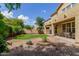 Backyard with beautiful landscaping, covered patio and a comfortable seating area at 4125 W Lydia Ln, Phoenix, AZ 85041