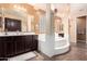 Bright and spacious bathroom featuring dual vanities, a soaking tub, and ample counter space at 4125 W Lydia Ln, Phoenix, AZ 85041