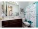 Cozy bathroom with patterned shower curtain and classic vanity at 4125 W Lydia Ln, Phoenix, AZ 85041