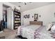 Bright bedroom with cozy bedding and a closet door and a bookshelf at 4125 W Lydia Ln, Phoenix, AZ 85041