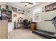 Comfortable carpeted bedroom with a home office setup and window at 4125 W Lydia Ln, Phoenix, AZ 85041