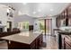 A spacious kitchen features an island, granite countertops, stainless steel appliances, and outside access at 4125 W Lydia Ln, Phoenix, AZ 85041