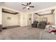 Expansive living area showcasing an open floor plan with a dining area, cozy seating, and recessed lighting at 4125 W Lydia Ln, Phoenix, AZ 85041