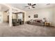 Spacious living room featuring neutral carpet, traditional furniture, and an open layout perfect for entertaining and relaxation at 4125 W Lydia Ln, Phoenix, AZ 85041