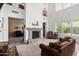 Open-concept living area with fireplace, grand ceilings, and modern touches offers comfort and elegance at 4125 W Lydia Ln, Phoenix, AZ 85041