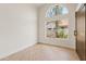 Bright bedroom with wood floors and large windows with neighborhood views at 438 E Hackamore St, Mesa, AZ 85203
