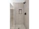 Modern walk-in shower featuring stylish tile work, glass enclosure, and updated fixtures at 438 E Hackamore St, Mesa, AZ 85203