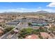 Aerial view of the community showcasing tennis courts, parking, and landscaped common areas at 4517 E Sourwood Dr, Gilbert, AZ 85298