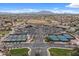 Aerial view of the community showcasing the parking, tennis courts, and golf course at 4517 E Sourwood Dr, Gilbert, AZ 85298
