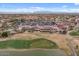 Expansive aerial showcasing the community clubhouse, pool, tennis courts and golf course, a vibrant neighborhood at 4517 E Sourwood Dr, Gilbert, AZ 85298