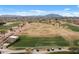 Beautiful aerial perspective of the golf course with lush green fairways and well-maintained grounds, a golfer's dream at 4517 E Sourwood Dr, Gilbert, AZ 85298
