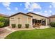Well-maintained backyard with lush lawn, patio area, and mature landscaping for outdoor enjoyment at 4517 E Sourwood Dr, Gilbert, AZ 85298