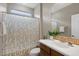 Bathroom with bamboo shower curtain, nice lighting and a modern sink at 4517 E Sourwood Dr, Gilbert, AZ 85298