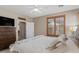 This bedroom boasts a ceiling fan, a TV on a dresser, and a neutral color scheme for relaxation at 4517 E Sourwood Dr, Gilbert, AZ 85298