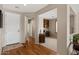 Welcoming foyer featuring hardwood floors and views into the office and other rooms at 4517 E Sourwood Dr, Gilbert, AZ 85298
