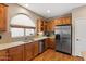 Kitchen featuring stainless steel appliances, breakfast bar, and plenty of cabinet space at 4517 E Sourwood Dr, Gilbert, AZ 85298