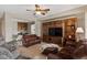 Comfortable living room with a built-in entertainment center and open access to the kitchen at 4517 E Sourwood Dr, Gilbert, AZ 85298