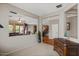 Open living space with hardwood floors and seamless flow between the living room, kitchen, and dining area at 4517 E Sourwood Dr, Gilbert, AZ 85298