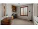 Bright home office with custom built-ins and a large window for natural light at 4517 E Sourwood Dr, Gilbert, AZ 85298