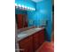 A bathroom with granite counters and dual sinks with storage at 4549 W Seldon Ln, Glendale, AZ 85302