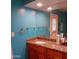 Bathroom with granite counters and sink and oversized mirror at 4549 W Seldon Ln, Glendale, AZ 85302