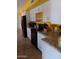 Modern kitchen with black appliances, granite countertops, and white cabinets at 4549 W Seldon Ln, Glendale, AZ 85302