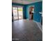 Bright living room with sliding glass doors leading to the pool area at 4549 W Seldon Ln, Glendale, AZ 85302