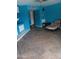 Open living room with neutral tile floors and an upholstered chair at 4549 W Seldon Ln, Glendale, AZ 85302