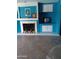 Living room with fireplace and built-in shelves at 4549 W Seldon Ln, Glendale, AZ 85302