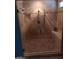 A modern tile shower with glass door and shower seat at 4549 W Seldon Ln, Glendale, AZ 85302