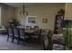 Traditional dining area featuring a wooden table and chairs, accented by elegant lighting and decor at 4800 N 68Th St # 314, Scottsdale, AZ 85251