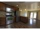 Bright kitchen with stainless steel appliances, breakfast bar, and access to the back patio at 4800 N 68Th St # 314, Scottsdale, AZ 85251
