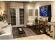 Cozy living area with a TV, comfortable seating and view to backyard at 4800 N 68Th St # 314, Scottsdale, AZ 85251