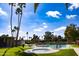 Resort-style pool area with palm trees and lounge chairs against a bright blue sky at 4800 N 68Th St # 314, Scottsdale, AZ 85251