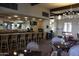 Upscale restaurant with a bar, tables, chairs, and decorative lighting at 4800 N 68Th St # 314, Scottsdale, AZ 85251