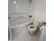 Clean bathroom featuring a white tub and shower combo with tiled floor at 533 W Guadalupe Rd # 1110, Mesa, AZ 85210