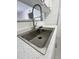 Close up of stainless steel sink with goose neck faucet, dish rack, and spray nozzle at 533 W Guadalupe Rd # 1110, Mesa, AZ 85210