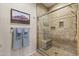 Tiled shower with glass enclosure and bench, complemented by neutral wall paint and decor at 5450 E Mclellan Rd # 145, Mesa, AZ 85205