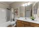 Neutral bathroom with a shower and vanity with framed mirror at 5450 E Mclellan Rd # 145, Mesa, AZ 85205