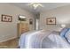 Bedroom features a comfy bed, dresser with TV, and serene artwork at 5450 E Mclellan Rd # 145, Mesa, AZ 85205