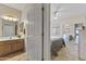 Partial view of bedroom and bathroom. Mirrored closet at 5450 E Mclellan Rd # 145, Mesa, AZ 85205