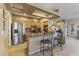 Open kitchen with granite countertops, stainless steel appliances, and breakfast bar seating at 5450 E Mclellan Rd # 145, Mesa, AZ 85205