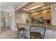 Kitchen with a breakfast bar featuring granite countertops and stainless steel appliances at 5450 E Mclellan Rd # 145, Mesa, AZ 85205