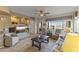 Bright and spacious living room featuring tile floors and a large window with golf course views at 5450 E Mclellan Rd # 145, Mesa, AZ 85205