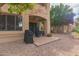 Side view of covered back patio with grill, ceiling fan, and outdoor seating area at 5450 E Mclellan Rd # 150, Mesa, AZ 85205