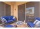 Enclosed back patio features comfortable outdoor seating and tiled flooring at 5450 E Mclellan Rd # 150, Mesa, AZ 85205