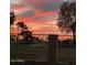 Scenic backyard view showcasing a community golf course against the backdrop of Arizona's sunset sky at 5450 E Mclellan Rd # 150, Mesa, AZ 85205