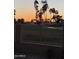 Scenic backyard view with iron fence overlooking the sunset at the community golf course and Arizona landscape at 5450 E Mclellan Rd # 150, Mesa, AZ 85205