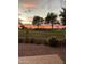 Beautiful backyard view with a covered patio overlooking the sunset, community golf course and Arizona landscape at 5450 E Mclellan Rd # 150, Mesa, AZ 85205