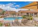 Relaxing community pool area with lounge chairs and shaded seating at 5450 E Mclellan Rd # 150, Mesa, AZ 85205